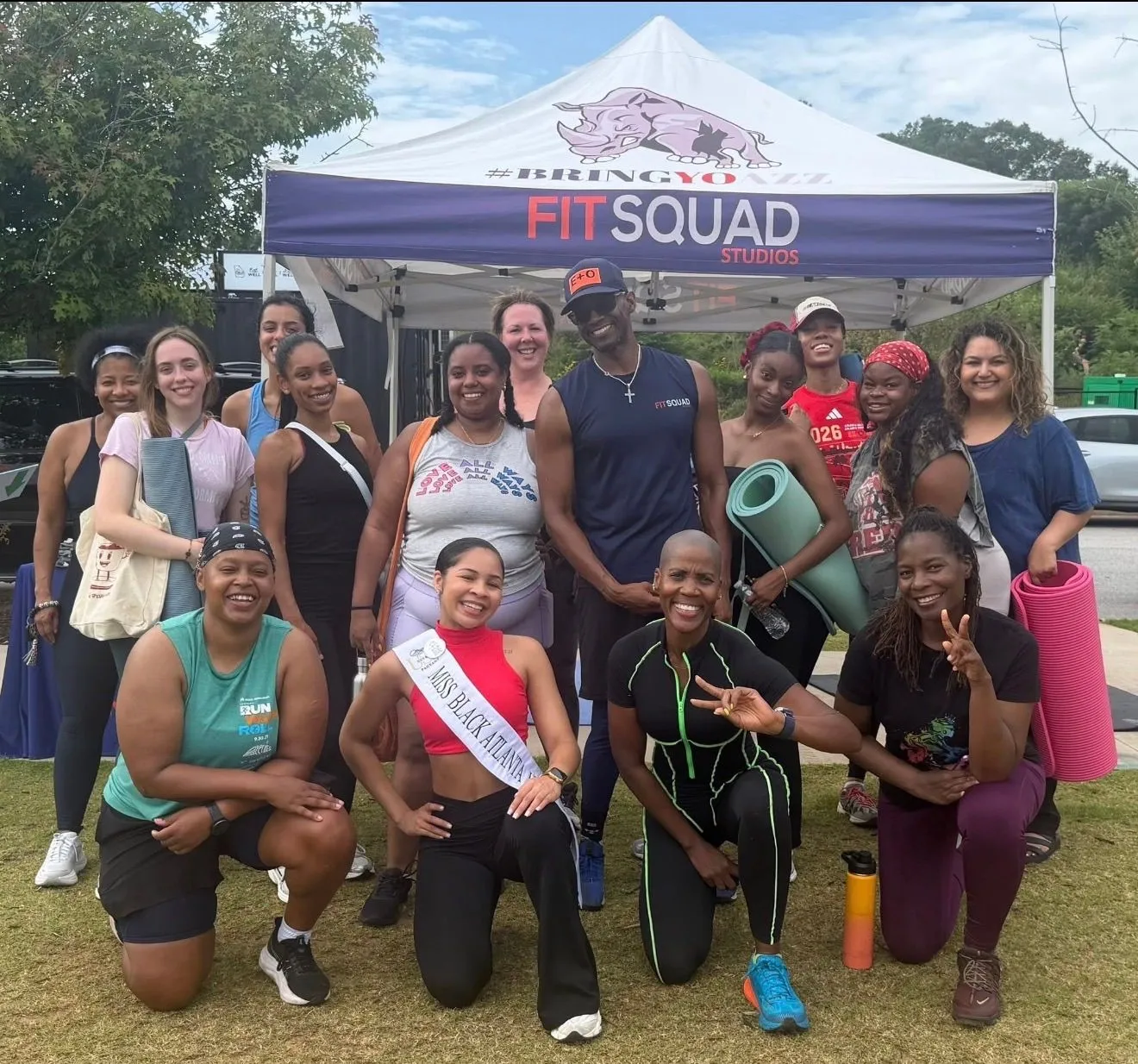FitSquad members taking part in a group stretch and wellness class at the studio
